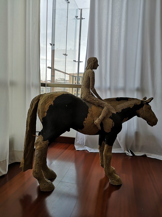 Horse and rider figure sculpture